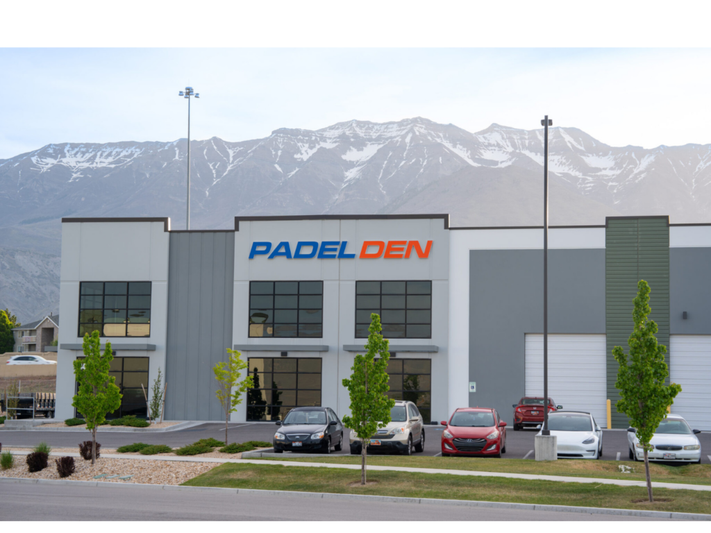 The exterior of the brand new Padel Den facility with snow-capped mountains in the background, offering the best padel in Orem.